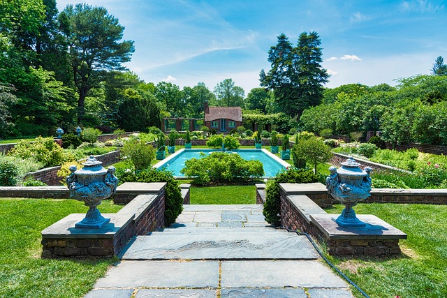 classic stone estate home with manicured gardens and circular fountain driveway